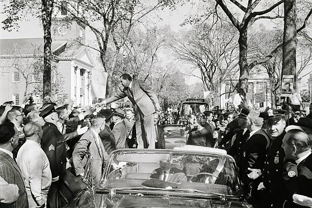 (Original Caption) 10/17/1960-New Haven, CT- Republican presidential candidate, Vice President Richard M. Nixon, greets an enthusiastic crowd from the top of a car. Nixon hit on the defense of the offshore Islands of Quemoy and Mahsu during his motor tour of Connecticut, pressing for a clearer statement of Senator Kennedy's views on this issue in his speech to the voters.