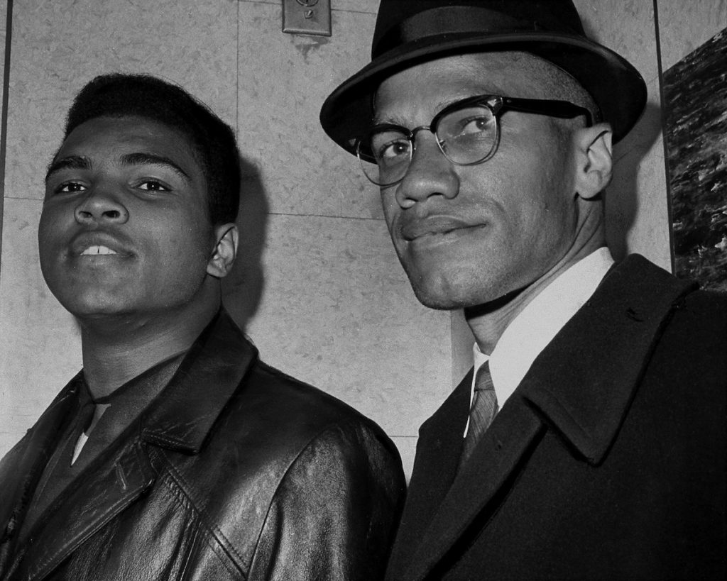 UNITED STATES - MARCH 02:  Cassius Marcellus Clay (Muhammad Ali) with Black Muslim leader Malcolm X at 125th St. and Seventh Ave.  (Photo by John Peodincuk/NY Daily News Archive via Getty Images)